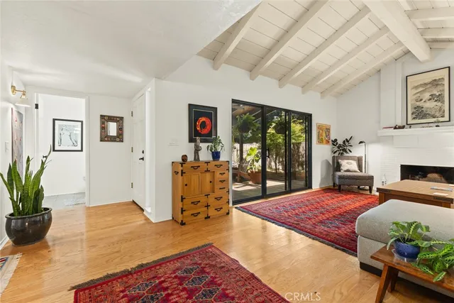 a living room with furniture rug and window