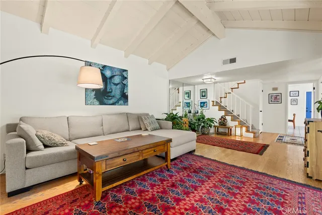 a living room with furniture and a rug