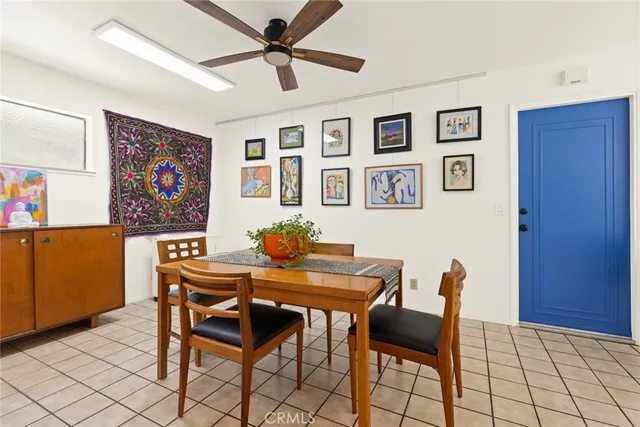 a view of a livingroom with furniture and a work space