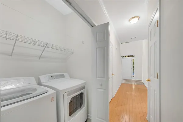 a view of storage and utility room with washer and dryer