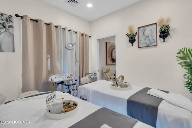 a view of a dining room with furniture and window