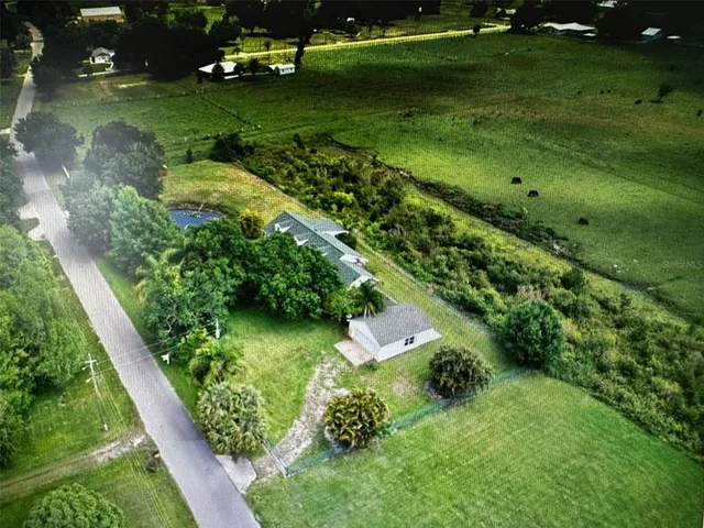 a view of a swimming pool with a yard