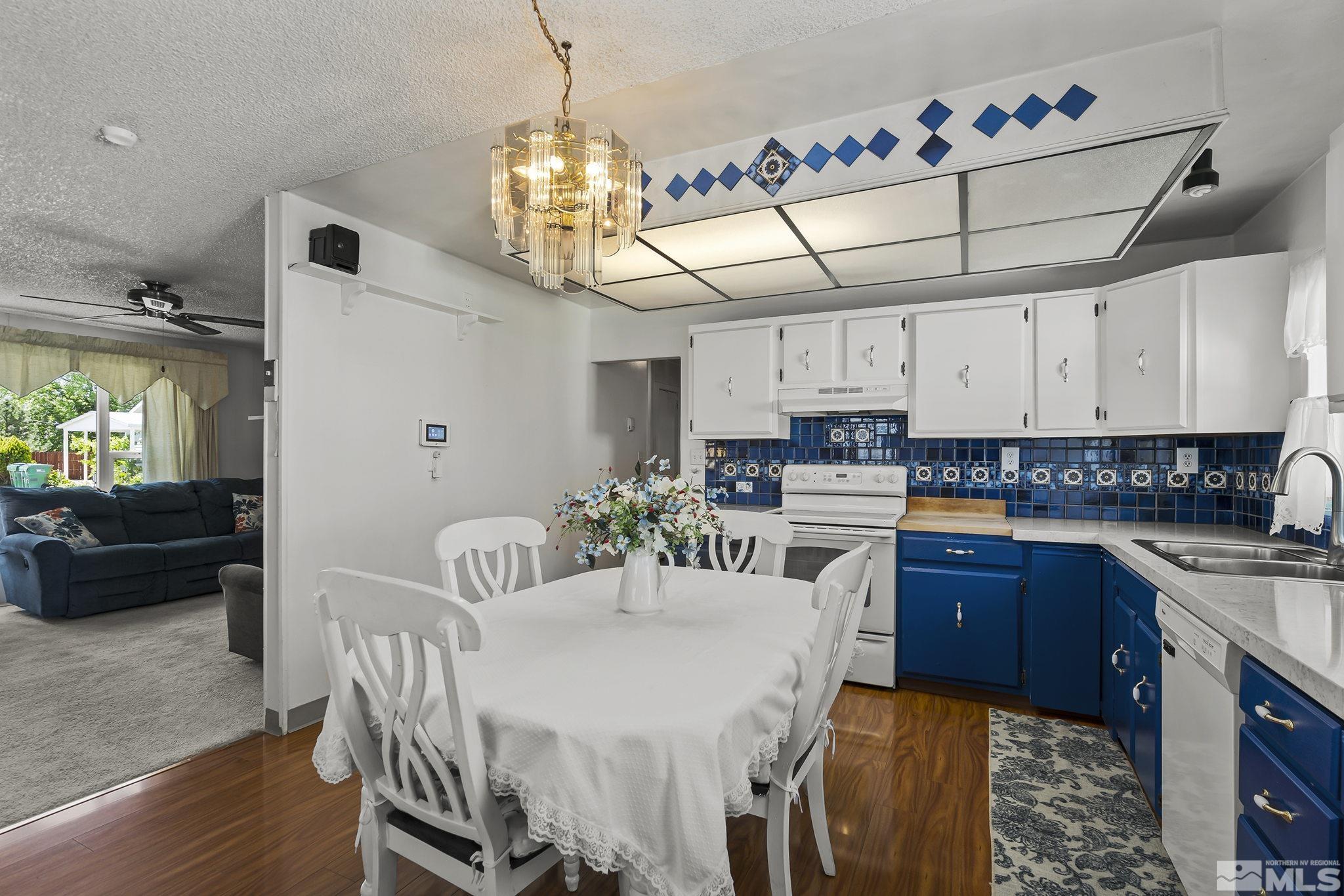 946 Lester Avenue Reno, NV 89502 - Photo 8 of 18 a kitchen with a dining table and chairs