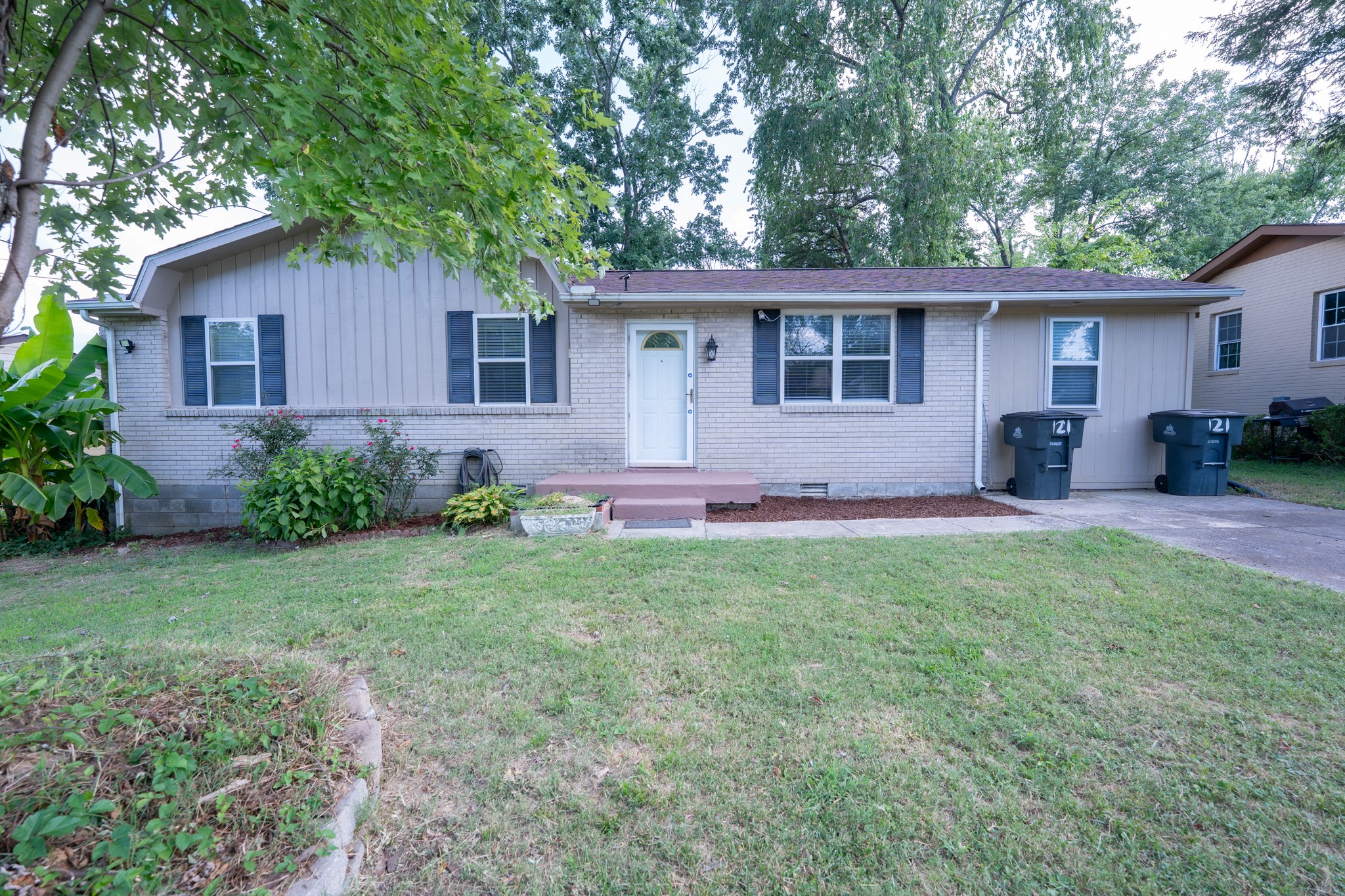 121 Tomarand Road Antioch, TN 37013 - Photo 1 of 34 a view of a house with back yard and a garden