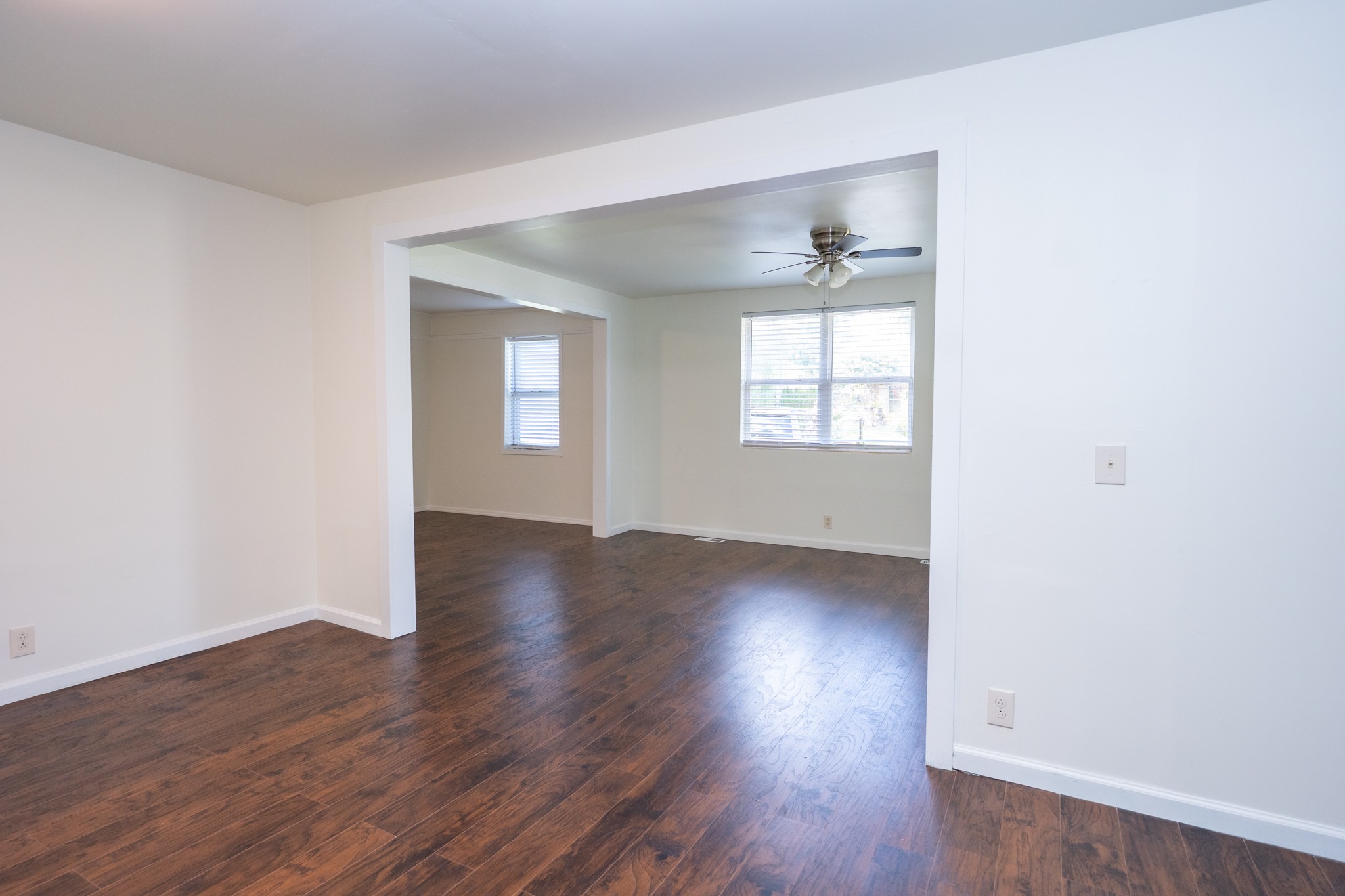 121 Tomarand Road Antioch, TN 37013 - Photo 11 of 34 an empty room with wooden floor and windows