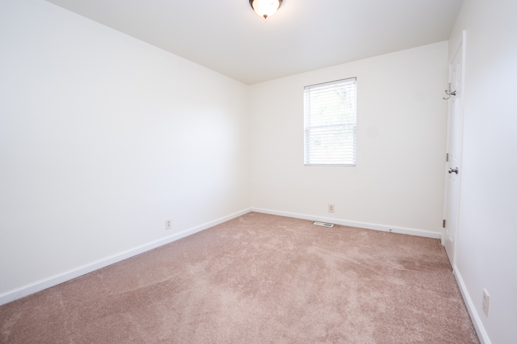 121 Tomarand Road Antioch, TN 37013 - Photo 13 of 34 an empty room with a window