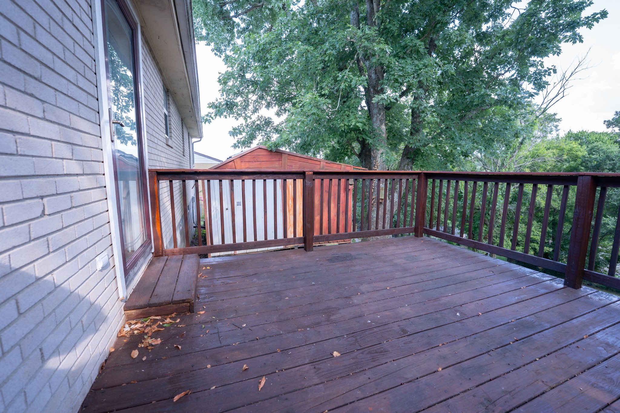 121 Tomarand Road Antioch, TN 37013 - Photo 26 of 34 a balcony with wooden floor and fence