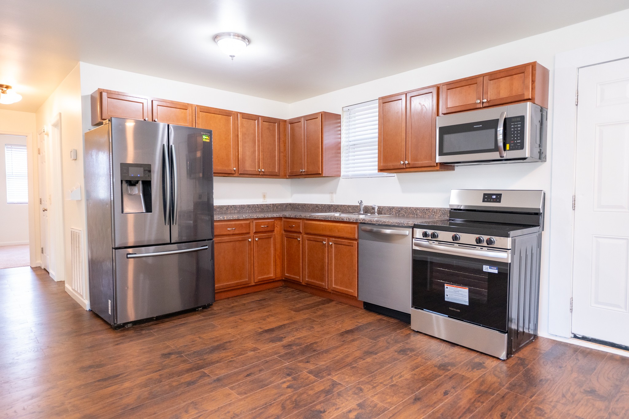 121 Tomarand Road Antioch, TN 37013 - Photo 3 of 34 a kitchen with stainless steel appliances a stove a sink and a refrigerator