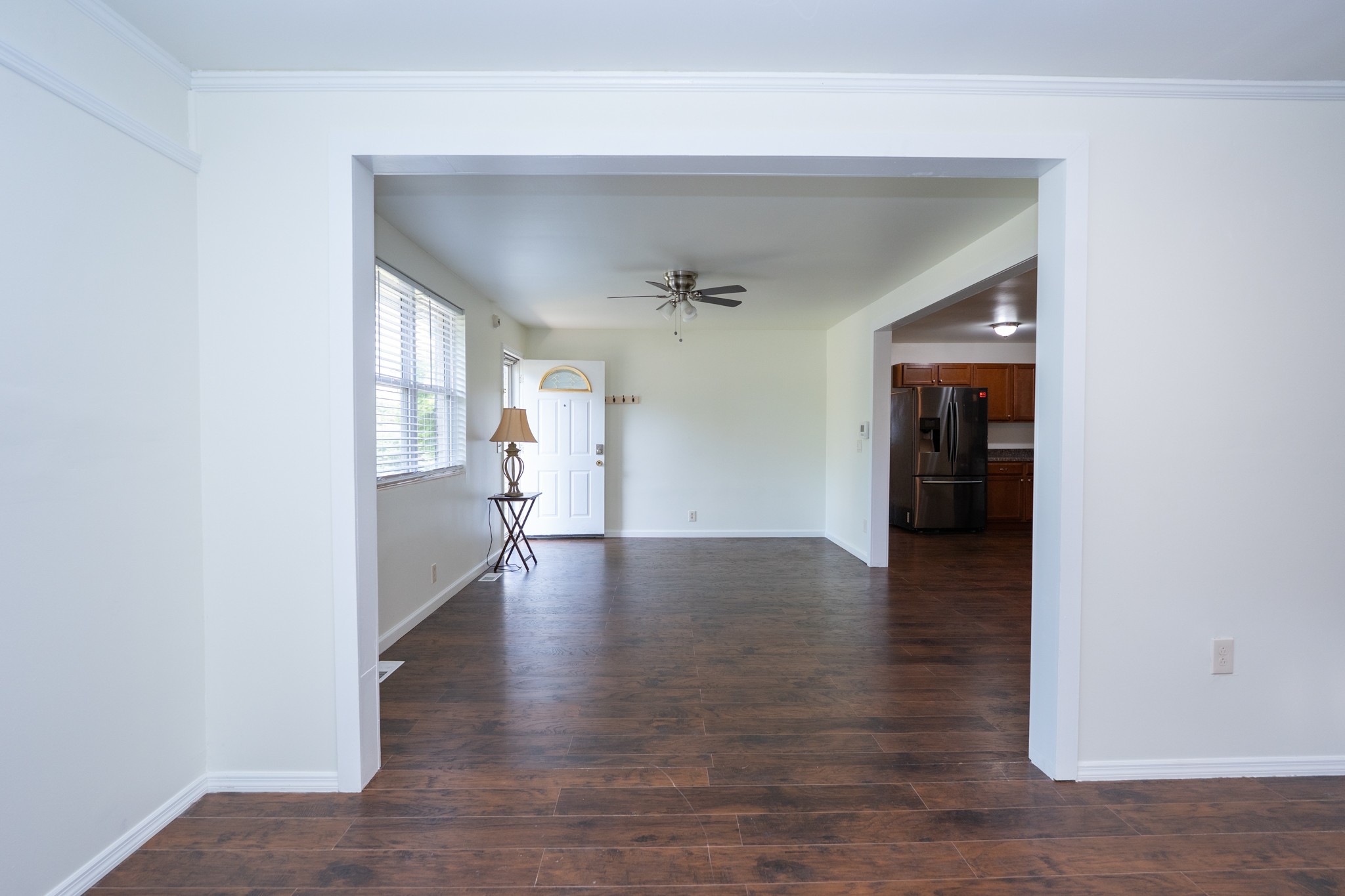 121 Tomarand Road Antioch, TN 37013 - Photo 6 of 34 a view of a hallway with wooden floor and a living room