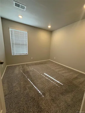 an empty room with a natural light
