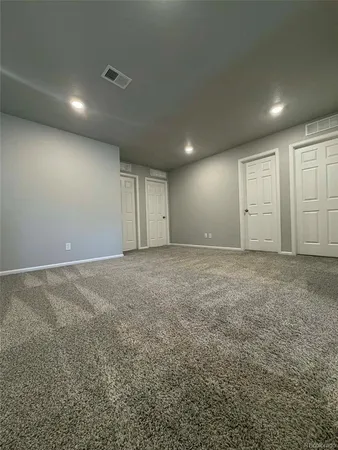 a bathroom with double vanity sink and a mirror