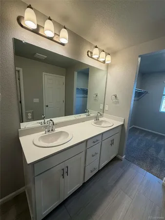 a bathroom with a toilet a sink and bathtub