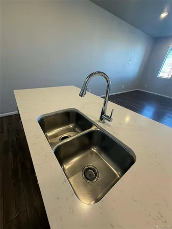 a close view of sink a faucet and washer