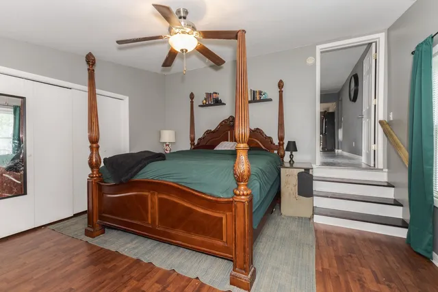 a room with stairs and a chandelier