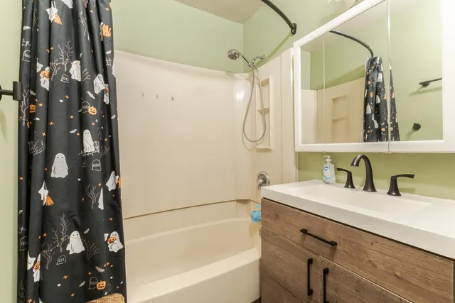 a bathroom with a sink and a bathtub