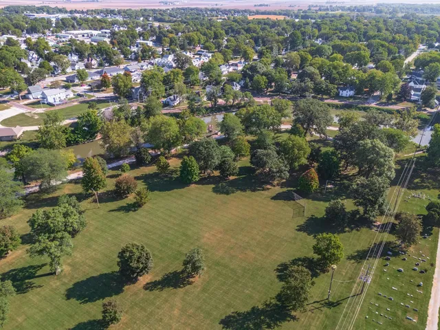 an aerial view of residential houses with outdoor space