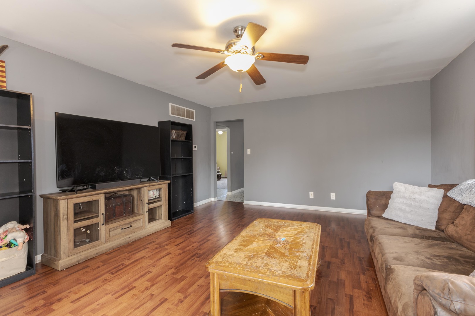 413 East Timber Street Pontiac, IL 61764 - Photo 4 of 36 a living room with furniture and a flat screen tv