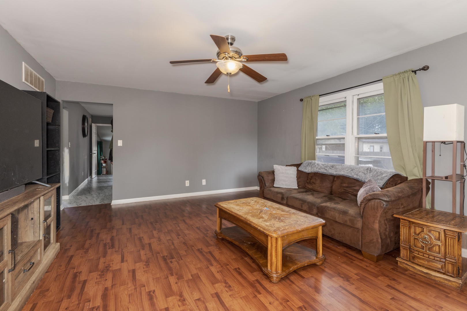 413 East Timber Street Pontiac, IL 61764 - Photo 6 of 36 a living room with furniture and a flat screen tv