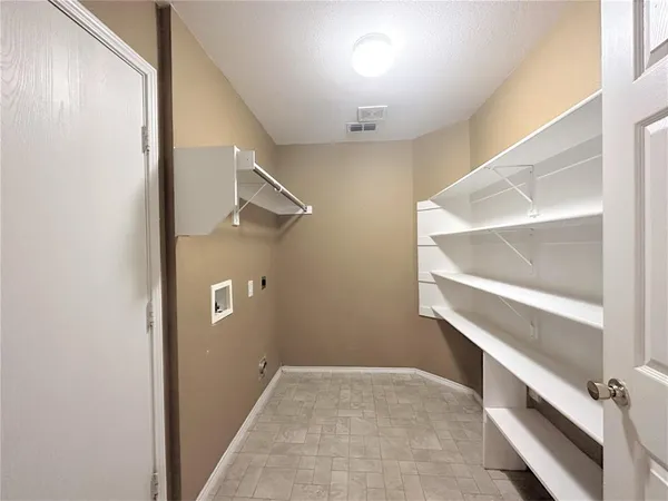 a white bath tub sitting next to a white toilet and a sink