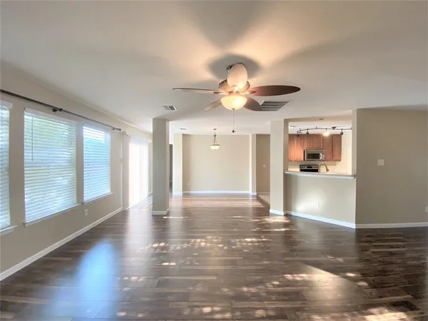 a large kitchen with cabinets a sink and a stove