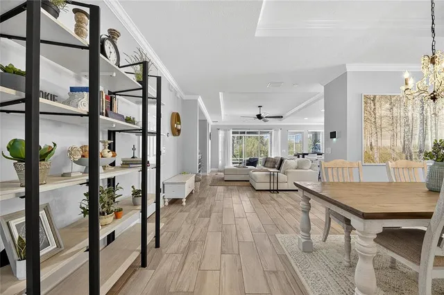 a dining room with furniture and window