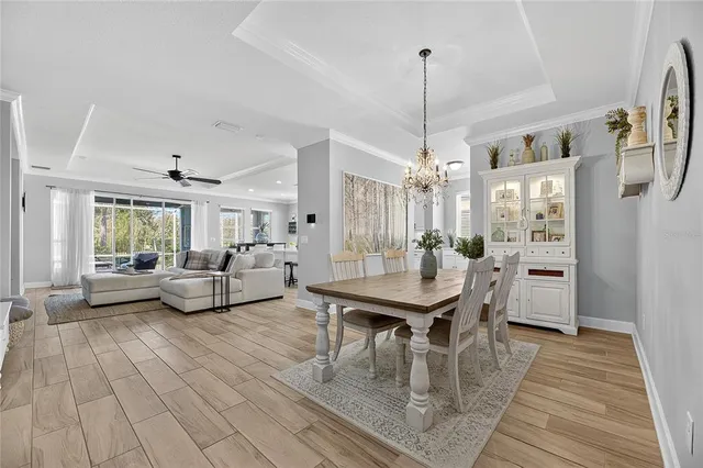 a view of hallway with furniture and a potted plant