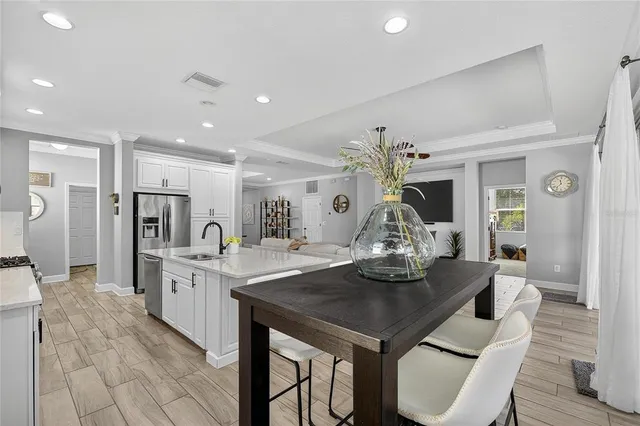 a spacious bedroom with a bed and a window