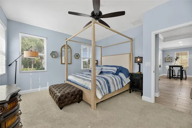 a bathroom with a bathtub shower sink and mirror