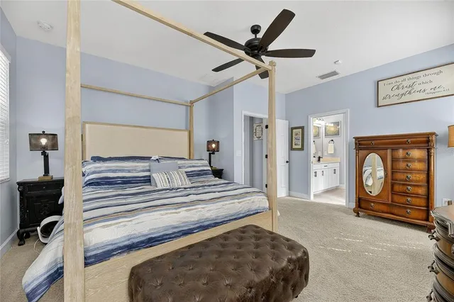 a white toilet sitting next to a white wall