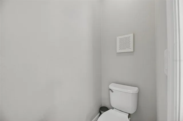 a building outdoor space with patio furniture and potted plants