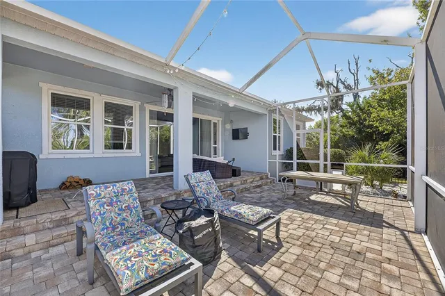 an aerial view of house with yard swimming pool and outdoor seating