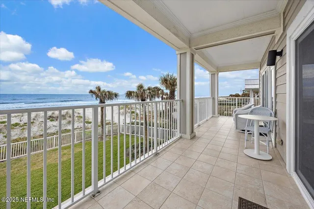 a view of a balcony with chairs