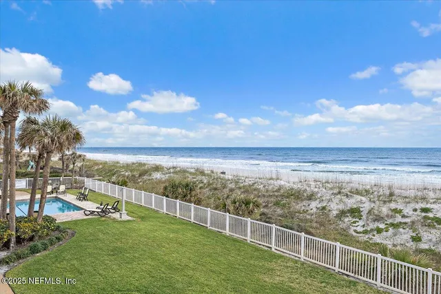 a view of a yard with an ocean view