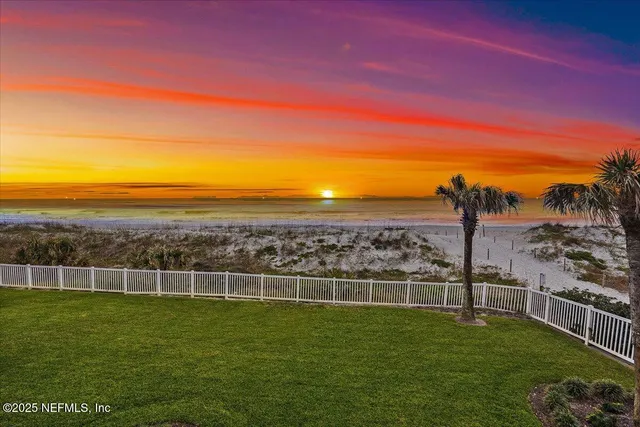 a view of a field with a big yard