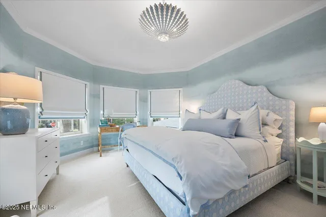 a large white bed in a white room