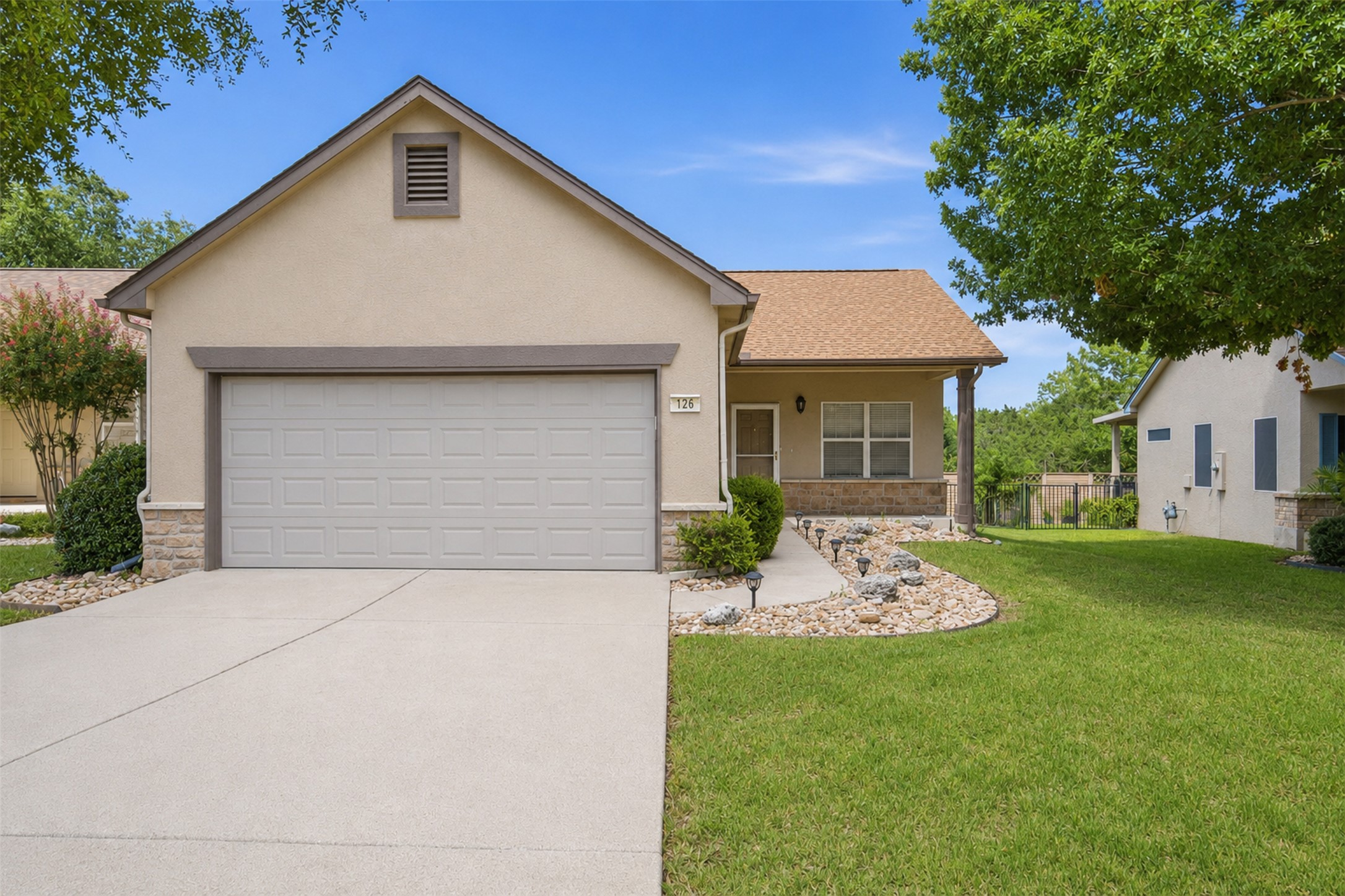 126 Whitewing Way Georgetown, TX 78633 - Photo 3 of 28 A well-maintained stucco home offers a concrete driveway and an attached two-car garage.