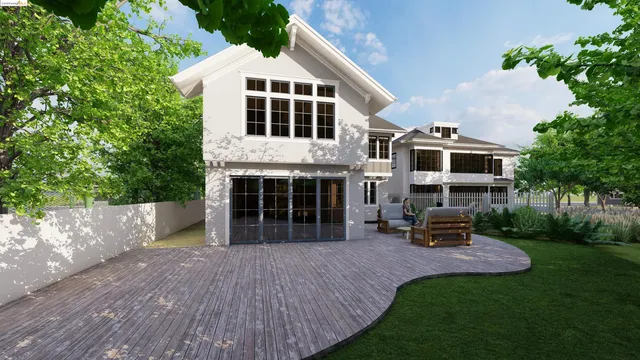 a front view of a house with a yard and trees