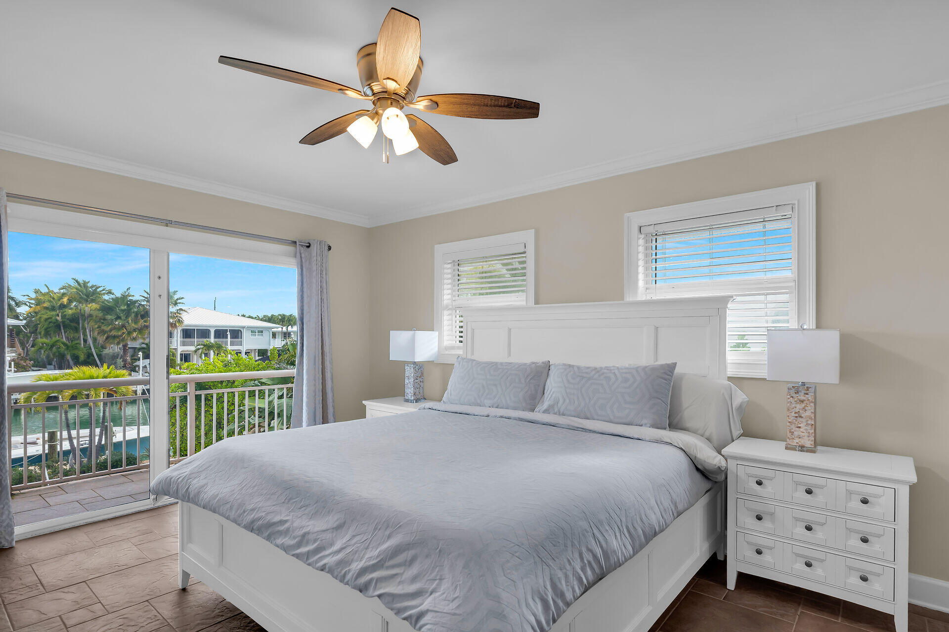 272 West Seaview Drive Duck Key, FL 33050 - Photo 11 of 26 a bedroom with a bed and a large window