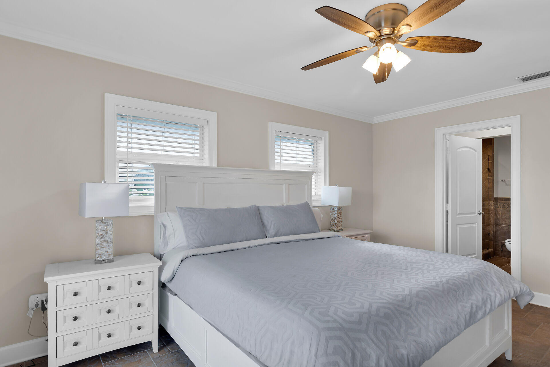 272 West Seaview Drive Duck Key, FL 33050 - Photo 12 of 26 a bedroom with a bed and a chandelier