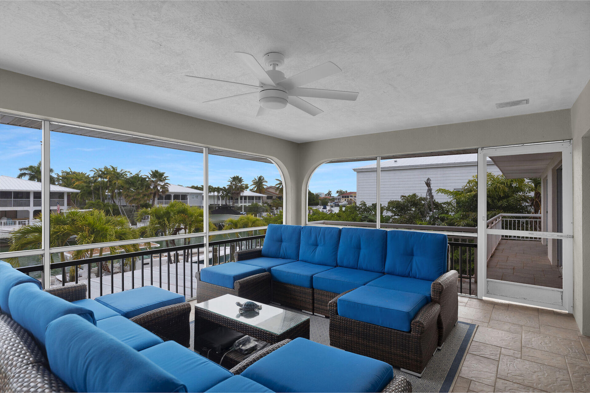 272 West Seaview Drive Duck Key, FL 33050 - Photo 17 of 26 a roof deck with couches and potted plants