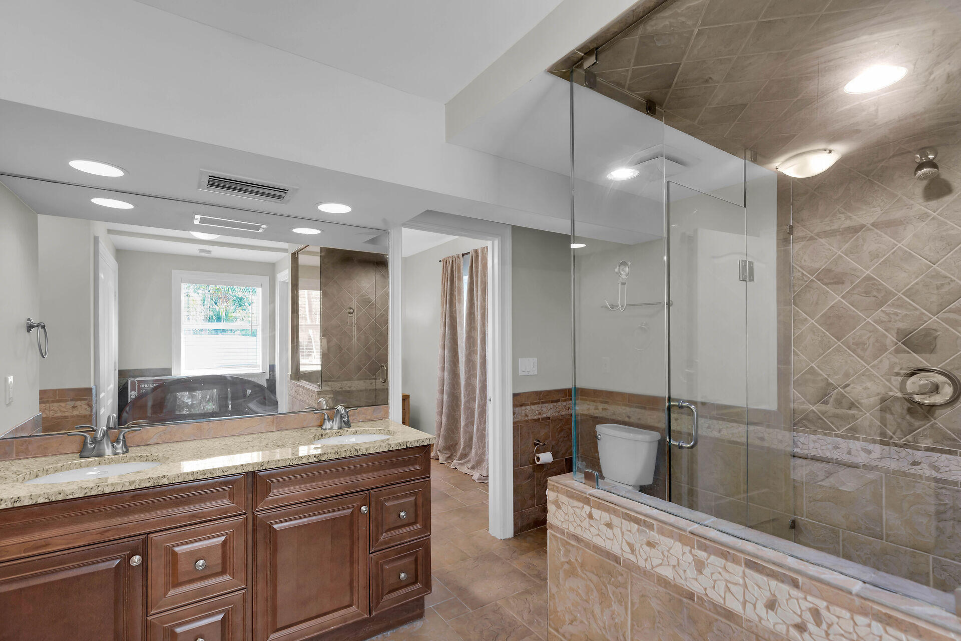 272 West Seaview Drive Duck Key, FL 33050 - Photo 20 of 26 a bathroom with a granite countertop sink mirror and double