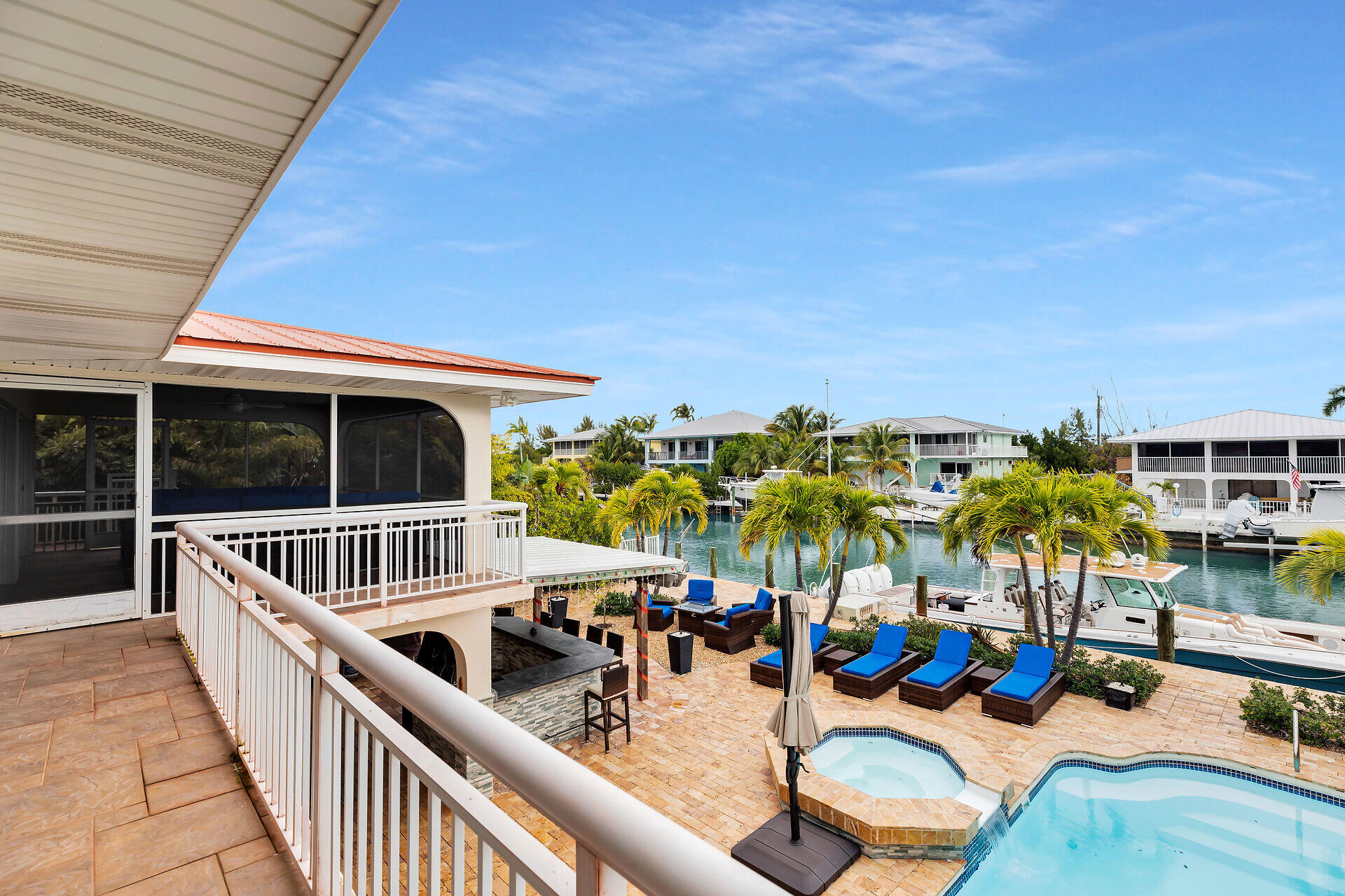 272 West Seaview Drive Duck Key, FL 33050 - Photo 2 of 26 a view of a swimming pool with outdoor seating