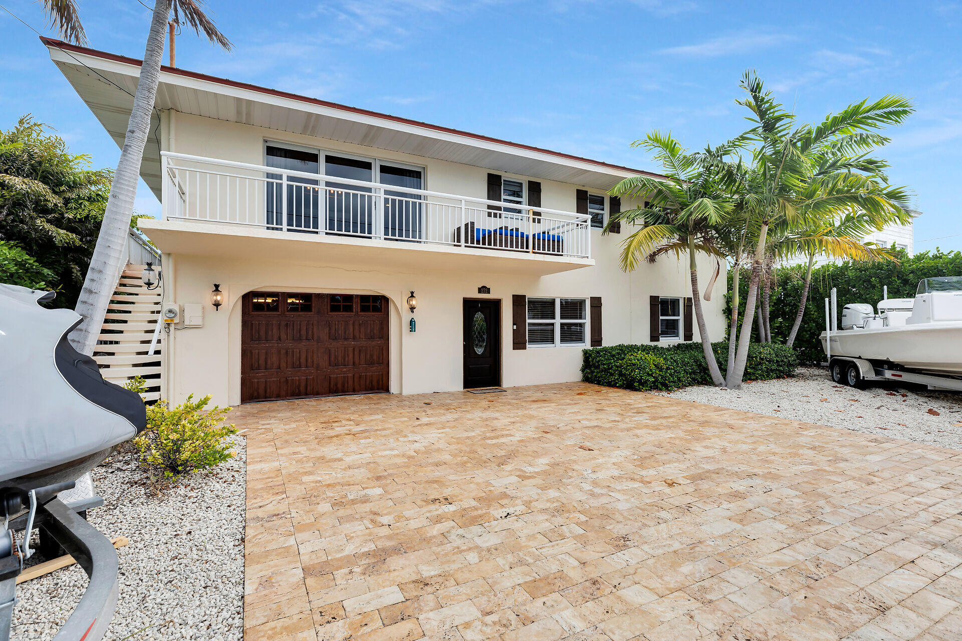 272 West Seaview Drive Duck Key, FL 33050 - Photo 4 of 26 a front view of a house with a yard