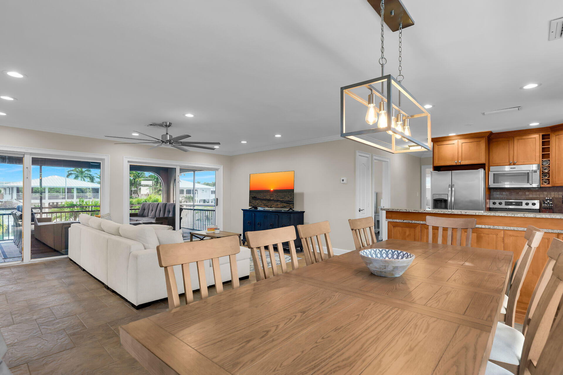 272 West Seaview Drive Duck Key, FL 33050 - Photo 10 of 26 a living room with furniture kitchen view and a chandelier