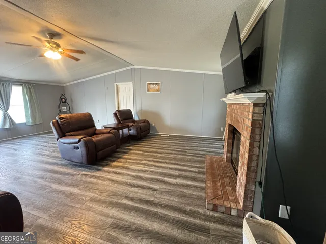 a bedroom with furniture and wooden floor