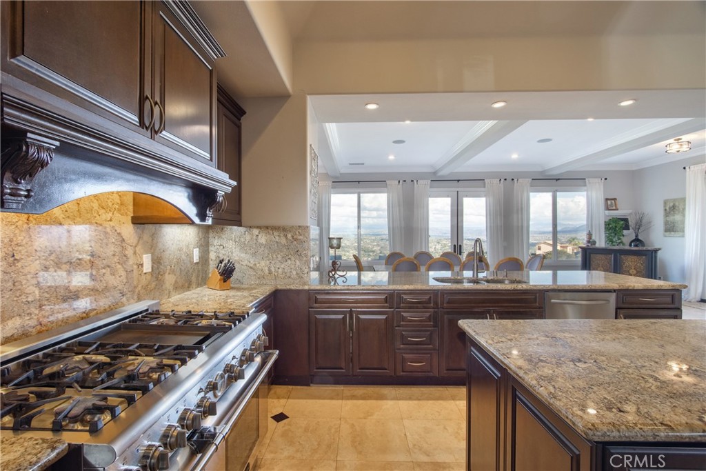 44195 Vía Horca Temecula, CA 92590 - Photo 17 of 74 a kitchen with sink stove and cabinets