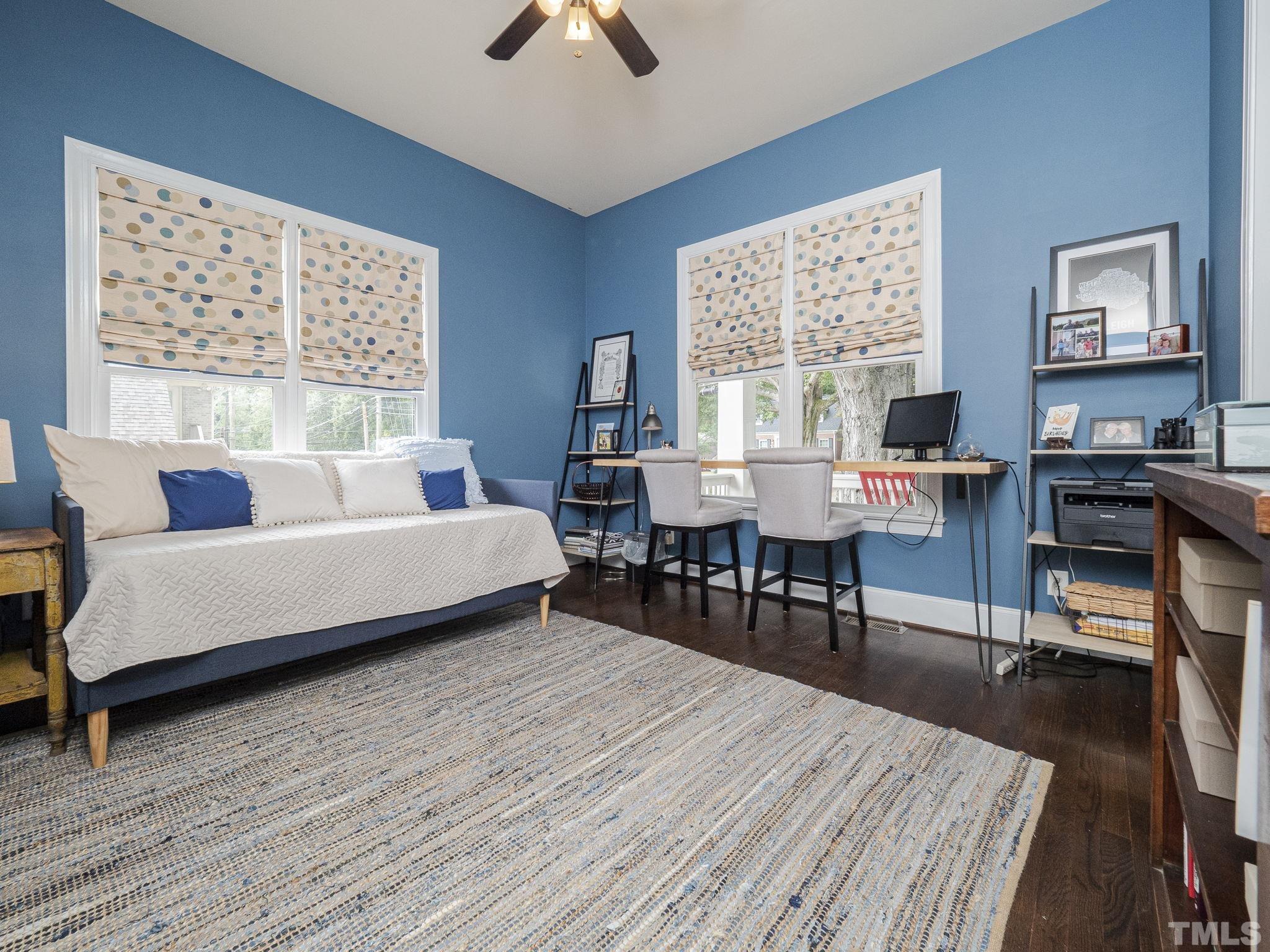 404 Brooks Avenue Raleigh, NC 27607 - Photo 17 of 18 a bed room with a bed and a table