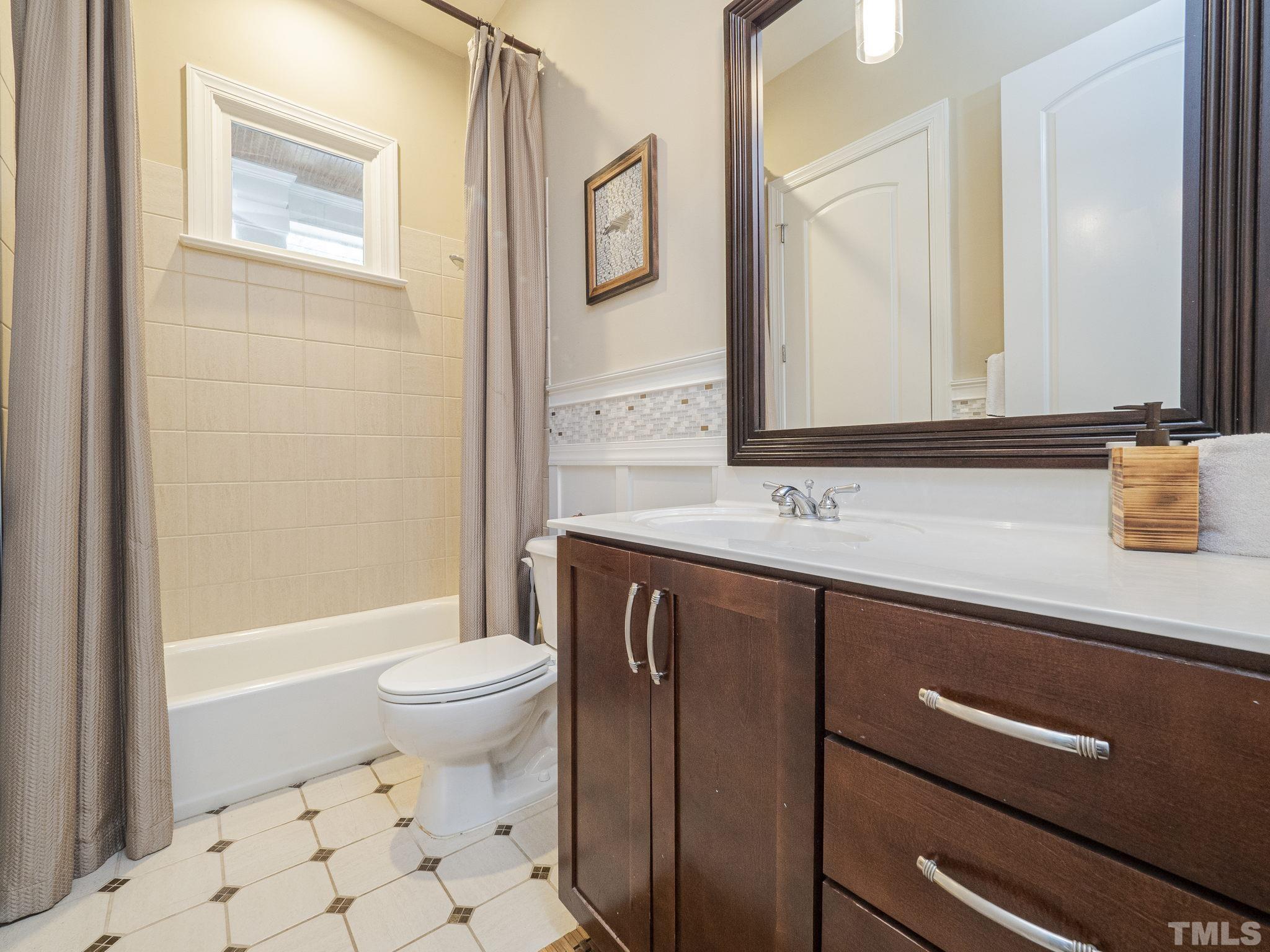 404 Brooks Avenue Raleigh, NC 27607 - Photo 18 of 18 a bathroom with a sink a toilet and shower