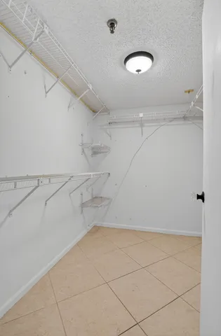 a view of a utility room with racks on the wall