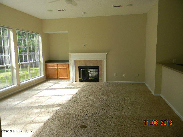 2568 Benjamin Road Jacksonville, FL 32223 - Photo 8 of 20 a view of empty room with a fireplace